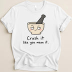 White t-shirt with mortar and pestle cartoon and text "Crush it like you mean it."