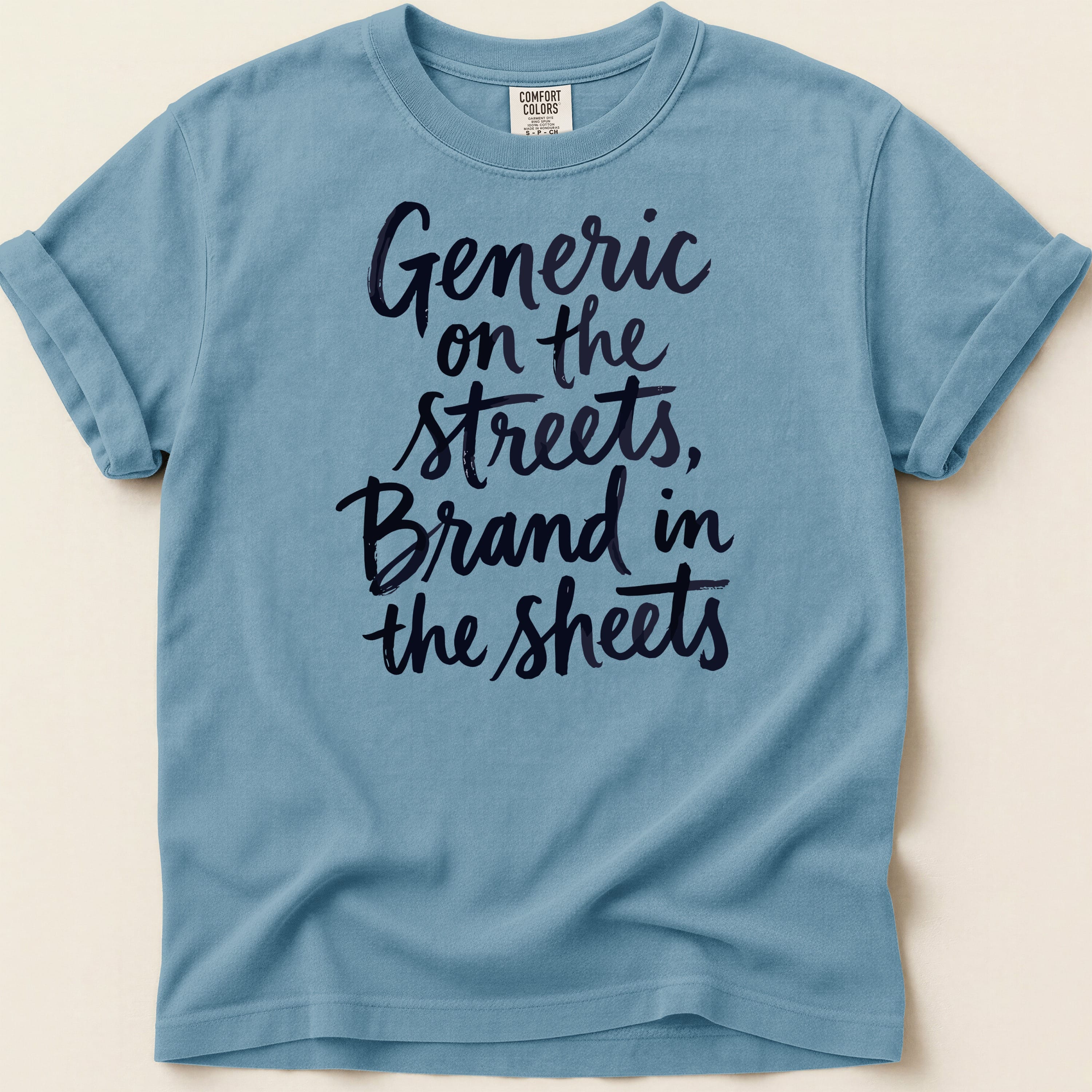 Blue t-shirt with "Generic on the streets, Brand in the sheets" text.