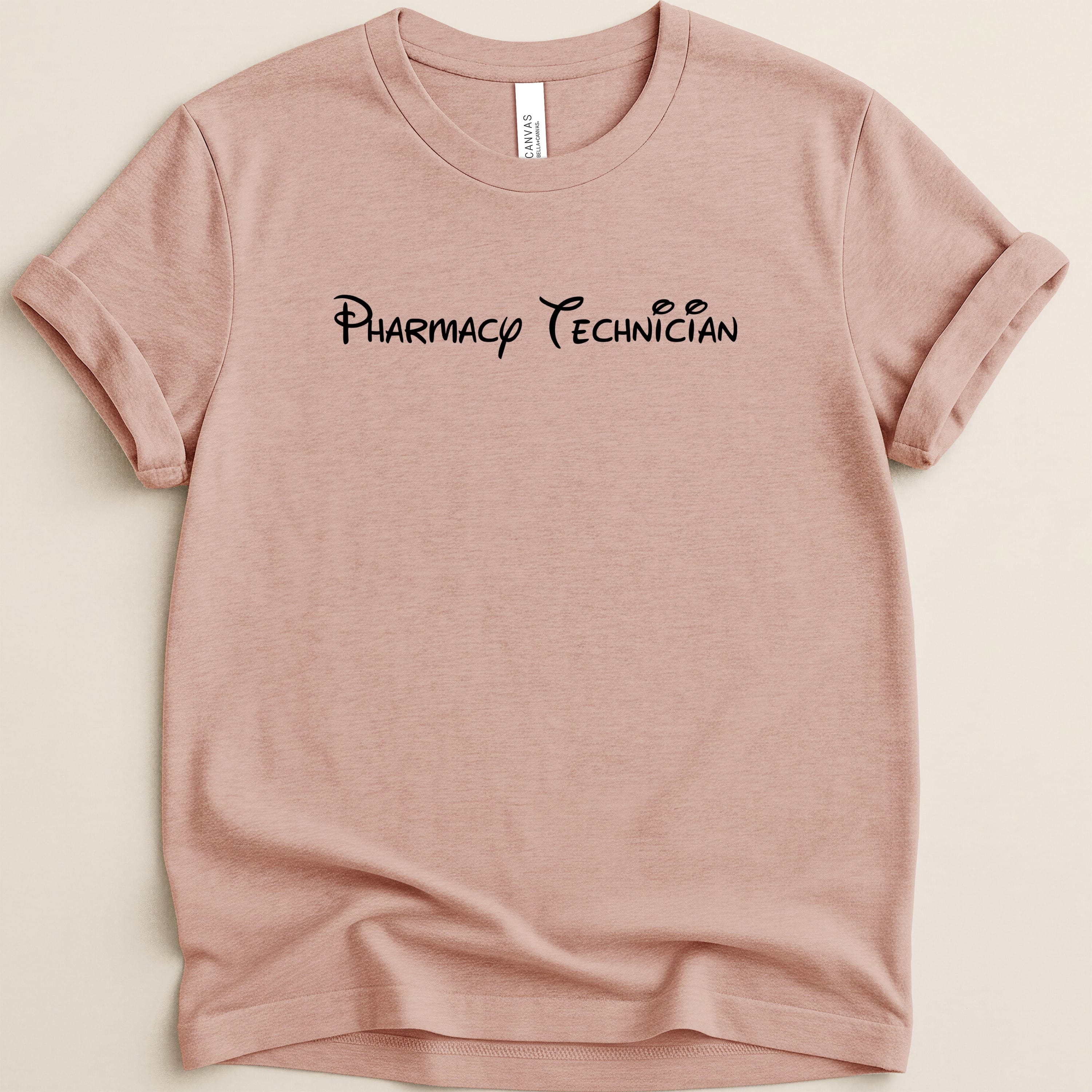 Pink t-shirt with "Pharmacy Technician" in stylized black font.
