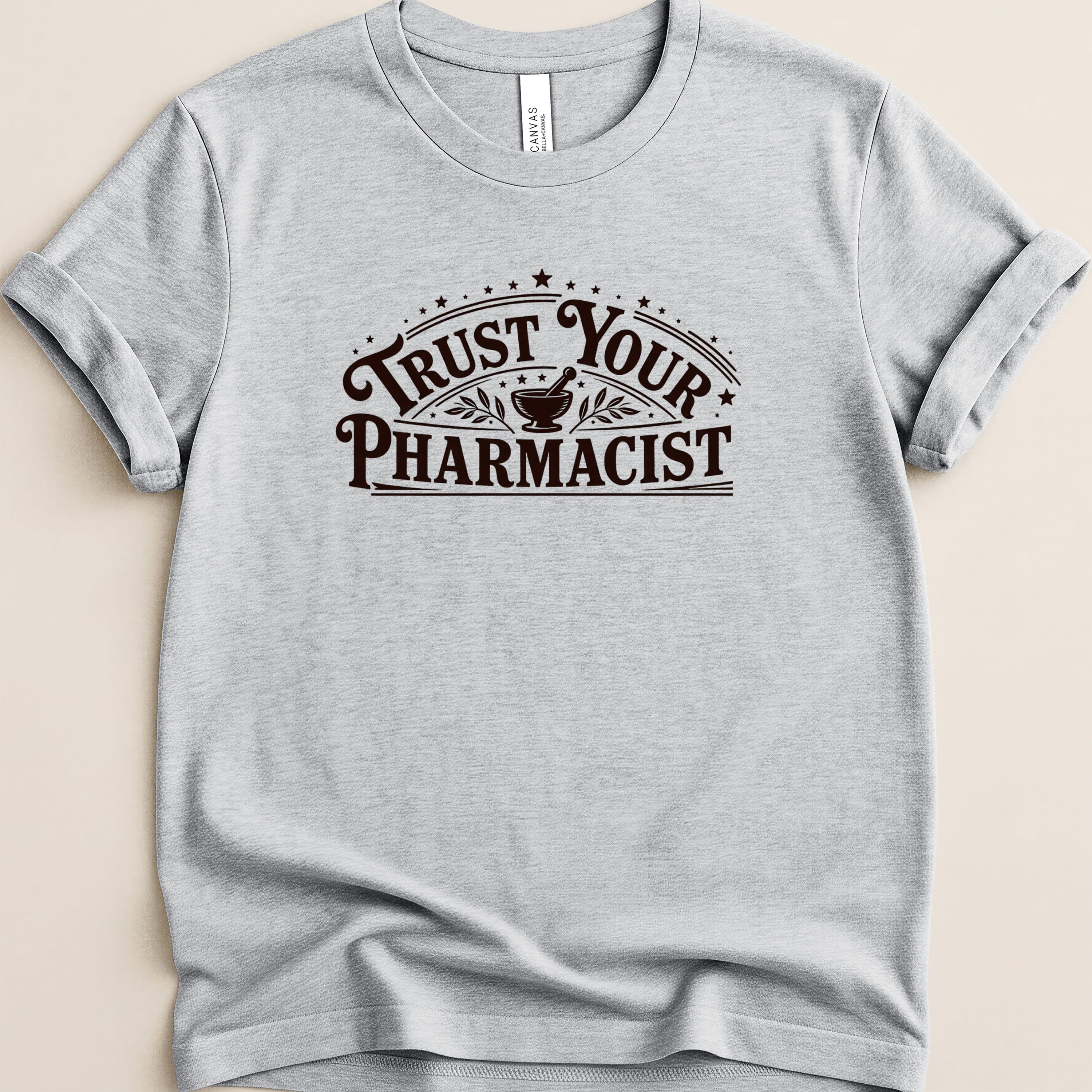 Gray t-shirt with "Trust Your Pharmacist" text and mortar and pestle graphic.