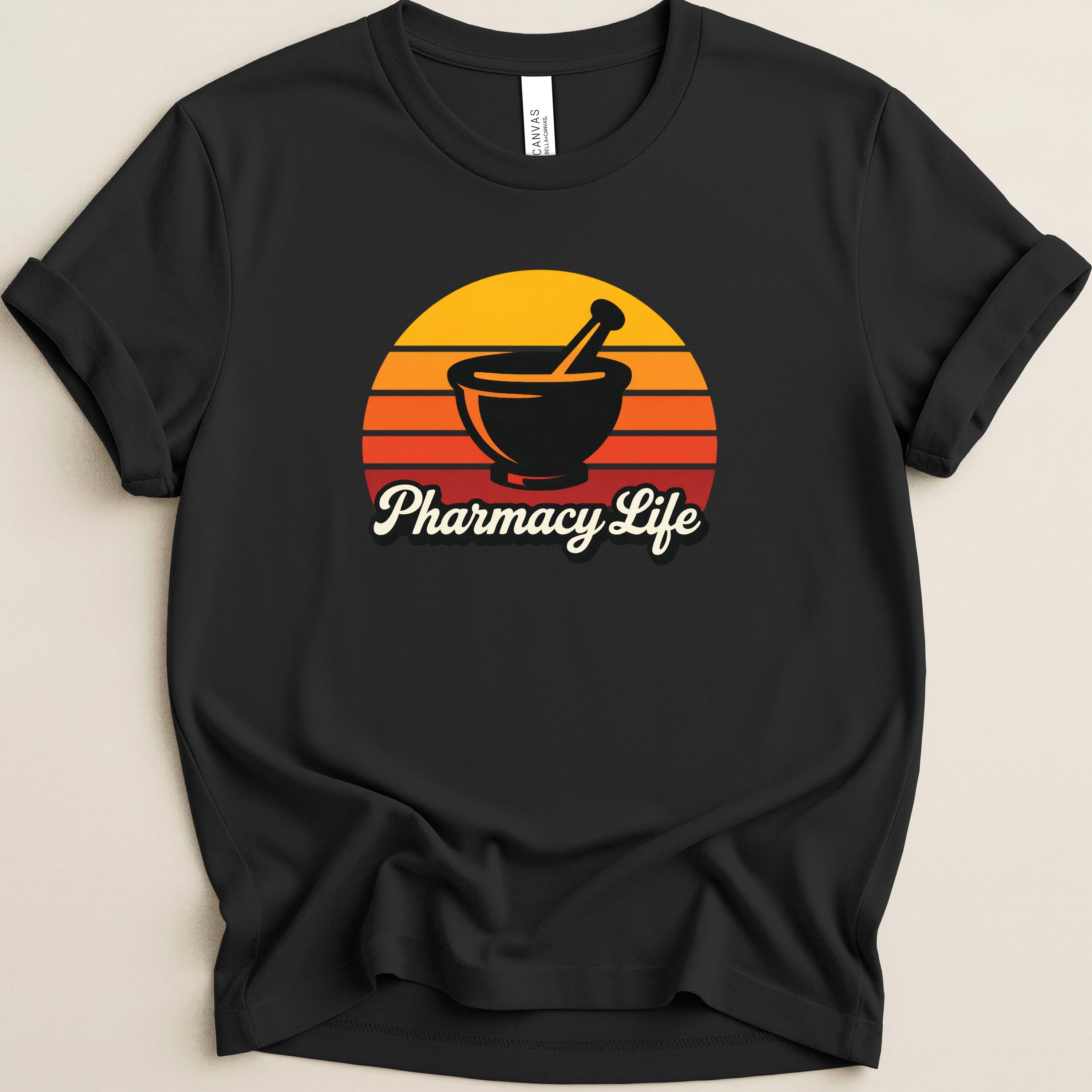 Black t-shirt with a sunset graphic featuring a mortar and pestle and the text "Pharmacy Life".