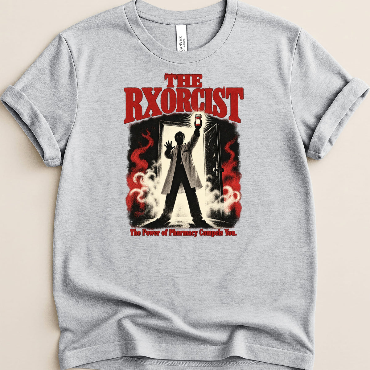Light grey t-shirt with "THE RXORCIST" text and a figure holding a pill bottle.