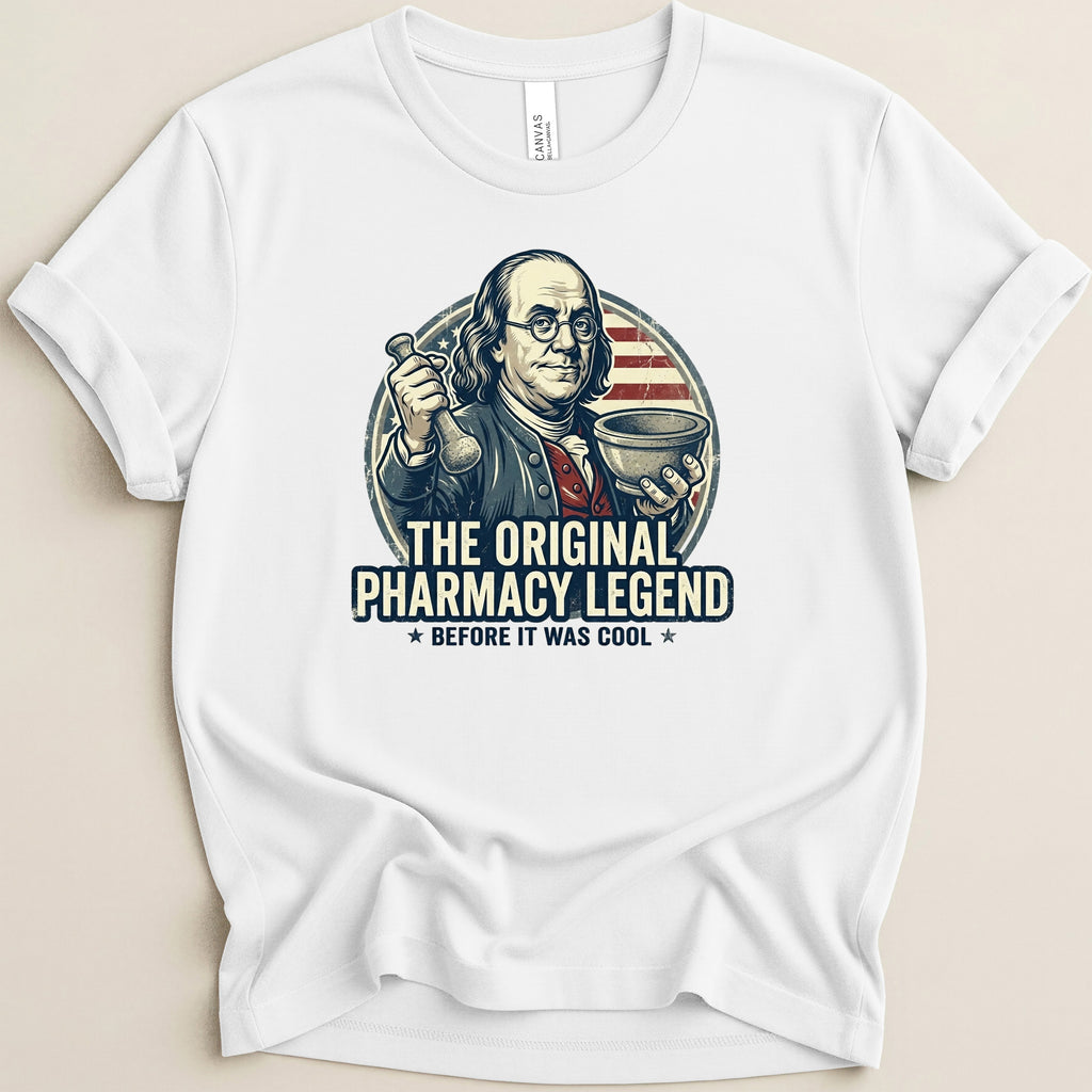 White t-shirt with Ben Franklin as a pharmacist, "The Original Pharmacy Legend" text.