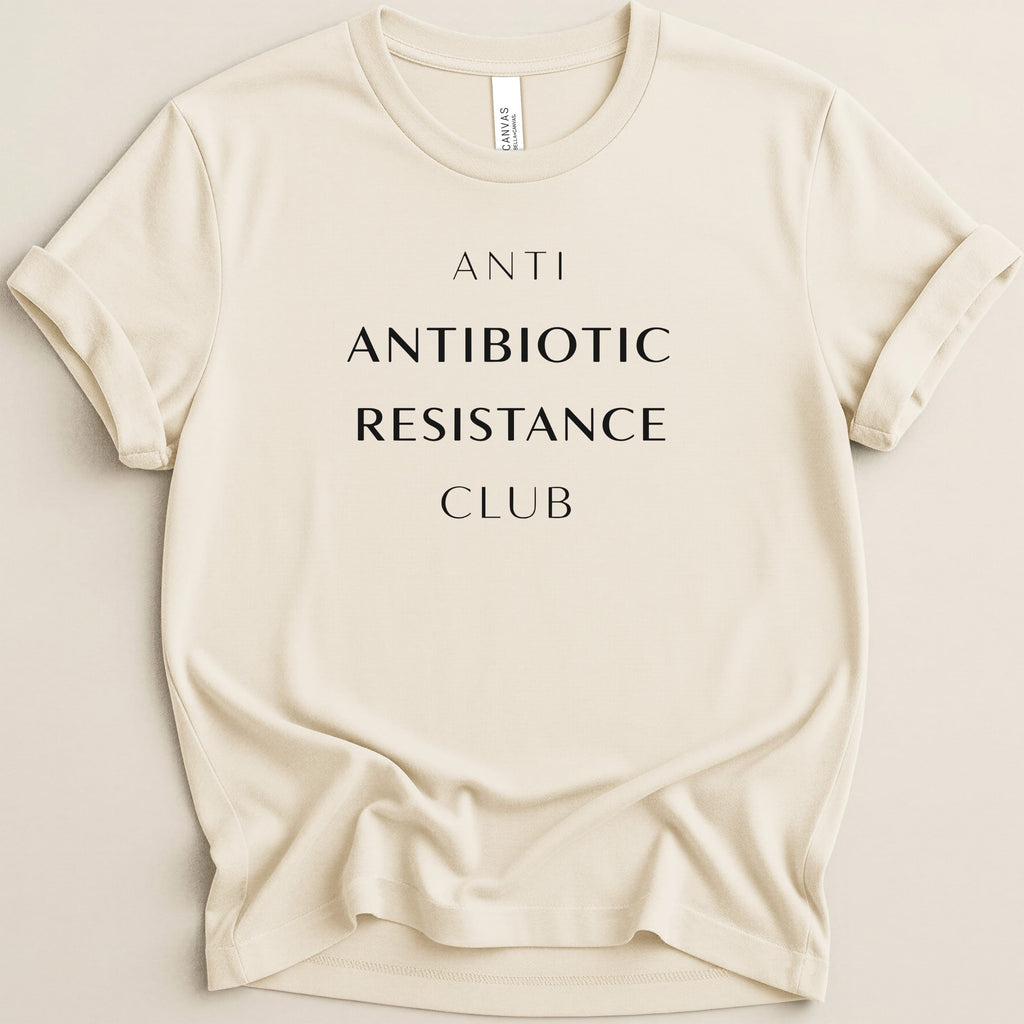 Cream t-shirt with "ANTI ANTIBIOTIC RESISTANCE CLUB" in black text.