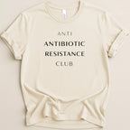 Cream t-shirt with "ANTI ANTIBIOTIC RESISTANCE CLUB" in black text.
