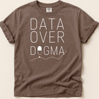 Brown t-shirt with white text "DATA OVER DOGMA" and a pill graphic.