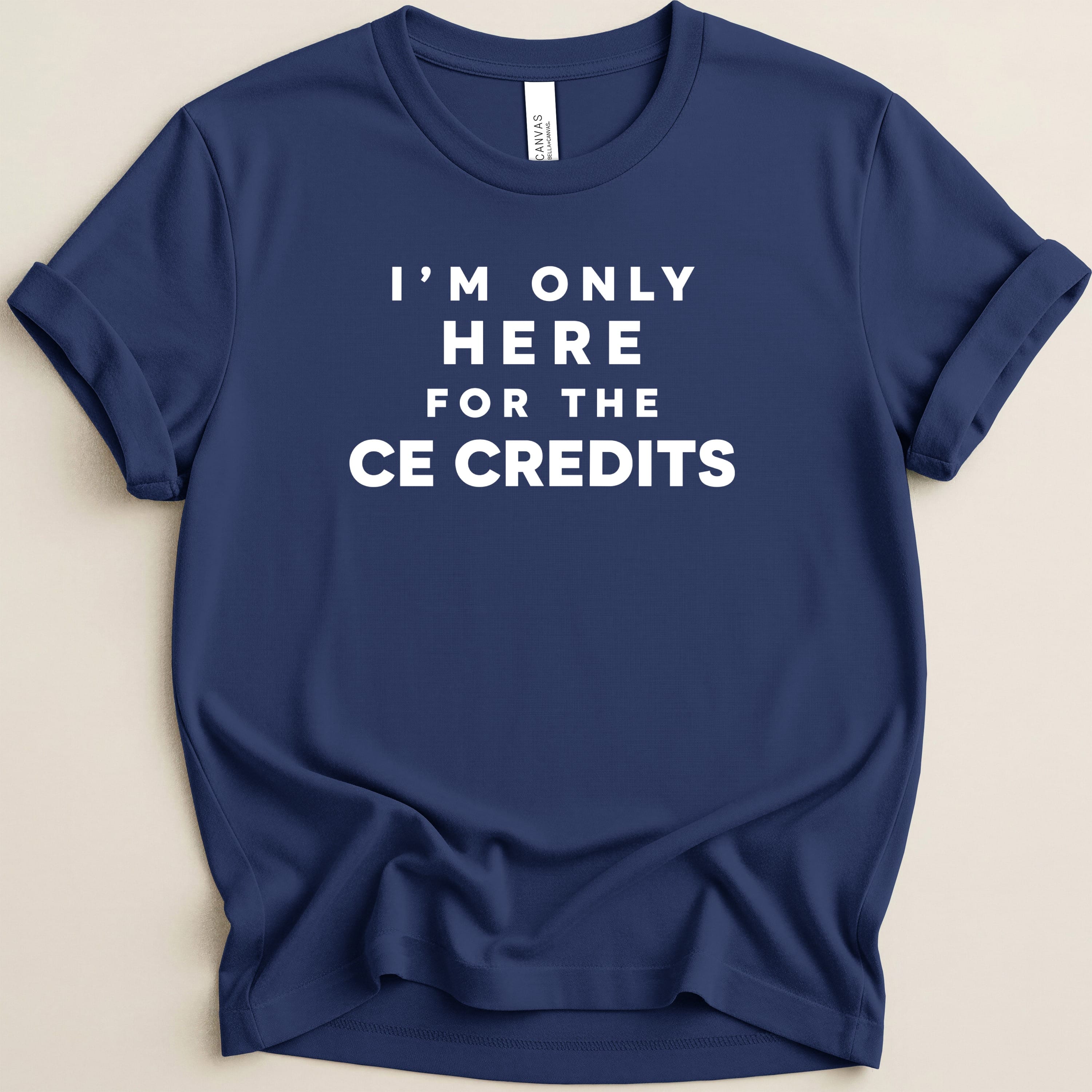Navy t-shirt with white text reading "I'm only here for the CE credits."