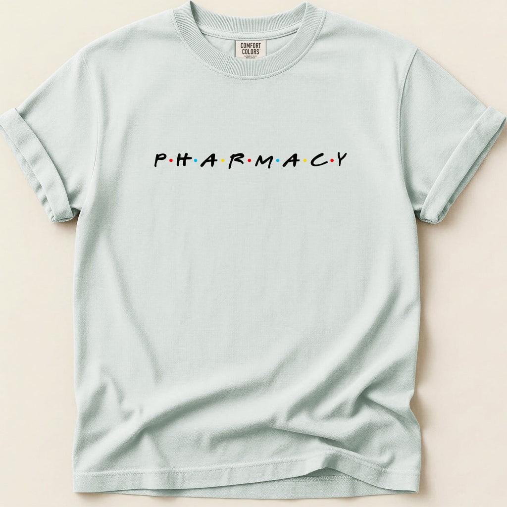 Light blue t-shirt with "PHARMACY" in colored dot letters.
