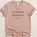 Pink t-shirt with "ANTI ANTIBIOTIC RESISTANCE CLUB" text.