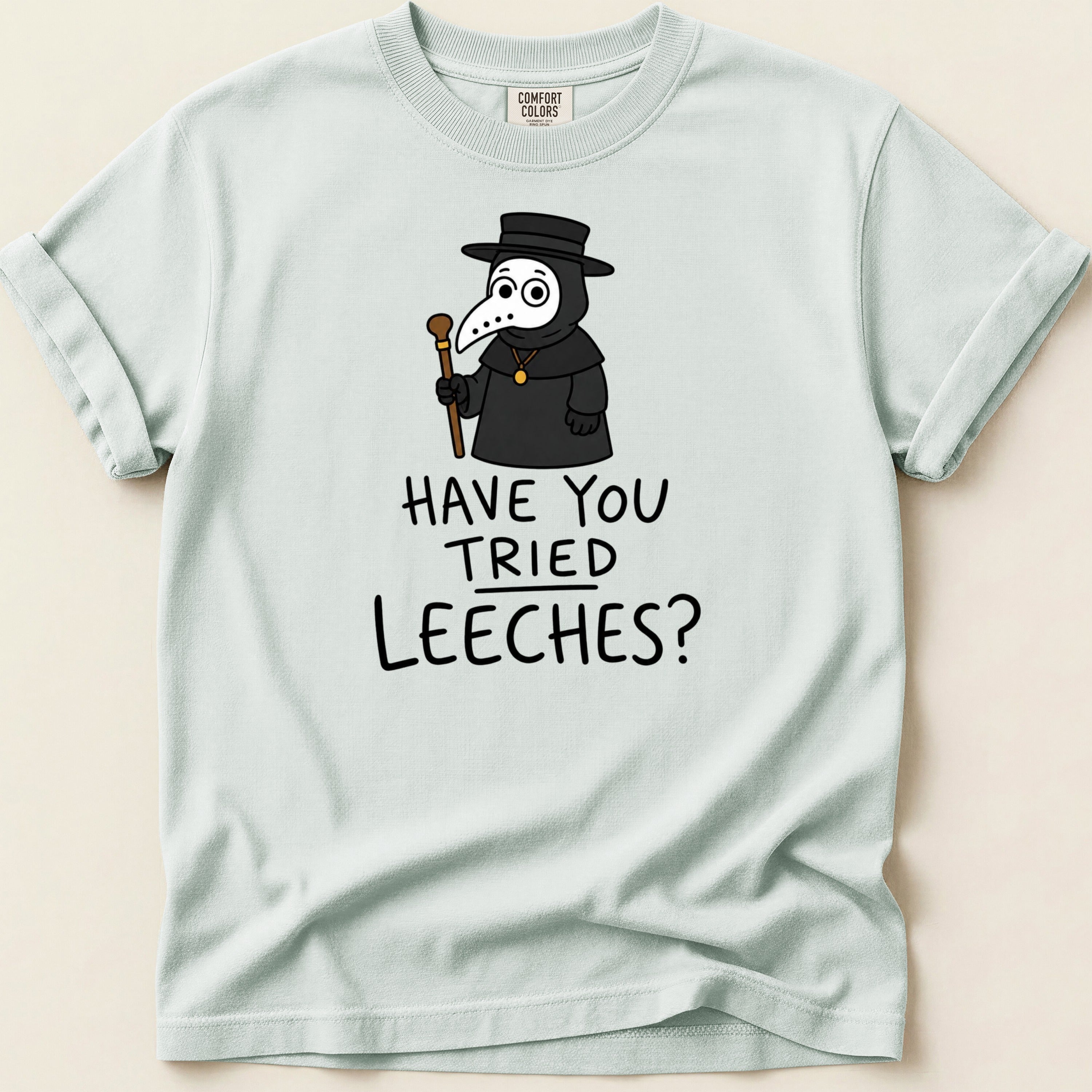 Plague doctor character with text "HAVE YOU TRIED LEECHES?" on t-shirt.