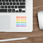 Rainbow sticker with "pharmacy" repeated six times, placed on a laptop.