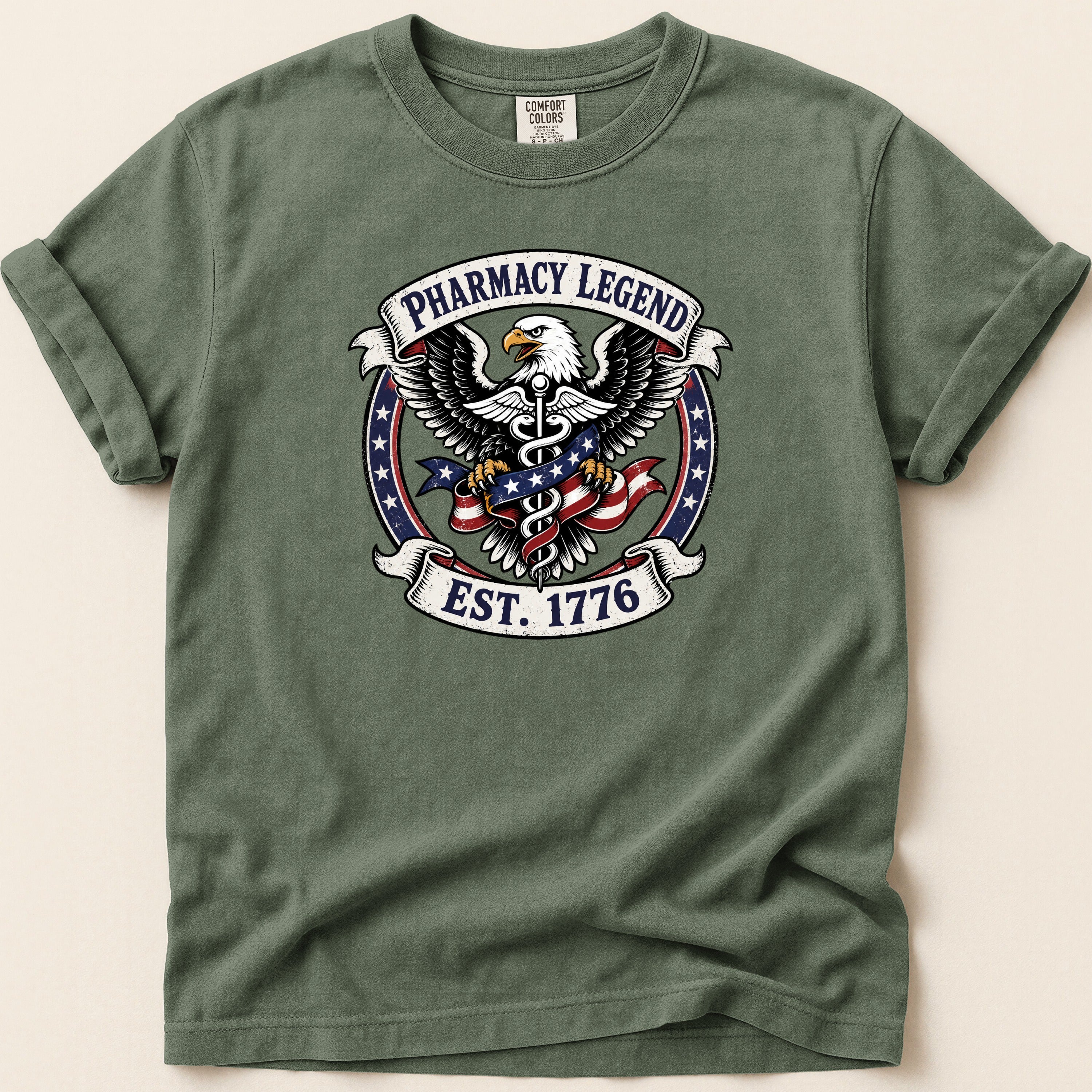 Green t-shirt with Pharmacy Legend Est. 1776 eagle emblem.