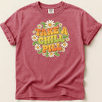 T-shirt with "Take a Chill Pill" and daisy graphic.