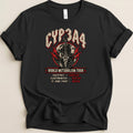 Black t-shirt with "CYP3A4 WORLD METABOLISM TOUR" text, guitar, and medical symbols.