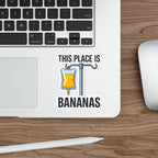 Sticker with IV bag labeled "THIS PLACE IS BANANAS" on a laptop.