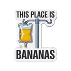 IV bag filled with yellow liquid hanging from a pole, text reads "This place is bananas".