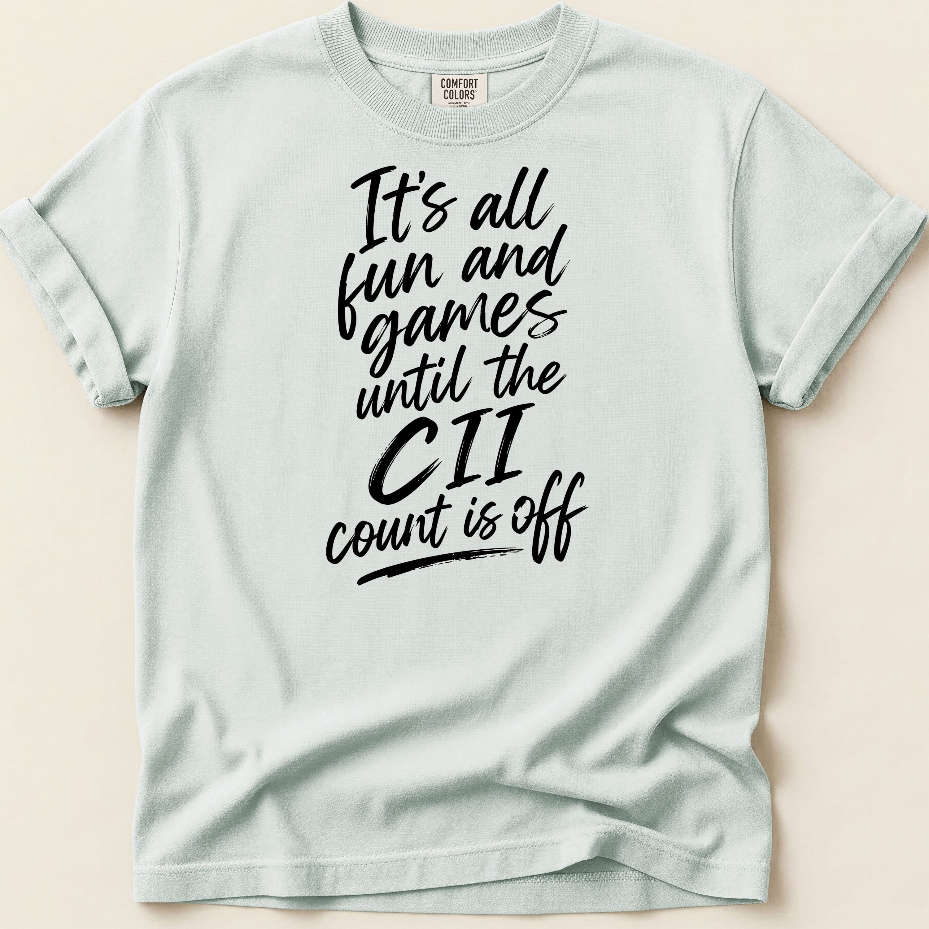 Light blue t-shirt with black text reading "It's all fun and games until the CII count is off."