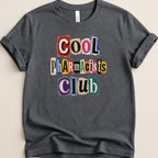 Dark t-shirt with "COOL Pharmacists CLUB" in cut-out letter style.