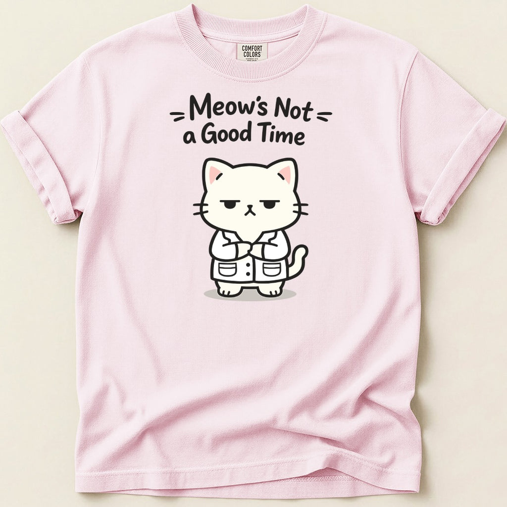 Pink t-shirt with a cartoon of a grumpy cat in a lab coat and text "Meow's Not a Good Time".