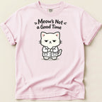 Pink t-shirt with a cartoon of a grumpy cat in a lab coat and text "Meow's Not a Good Time".