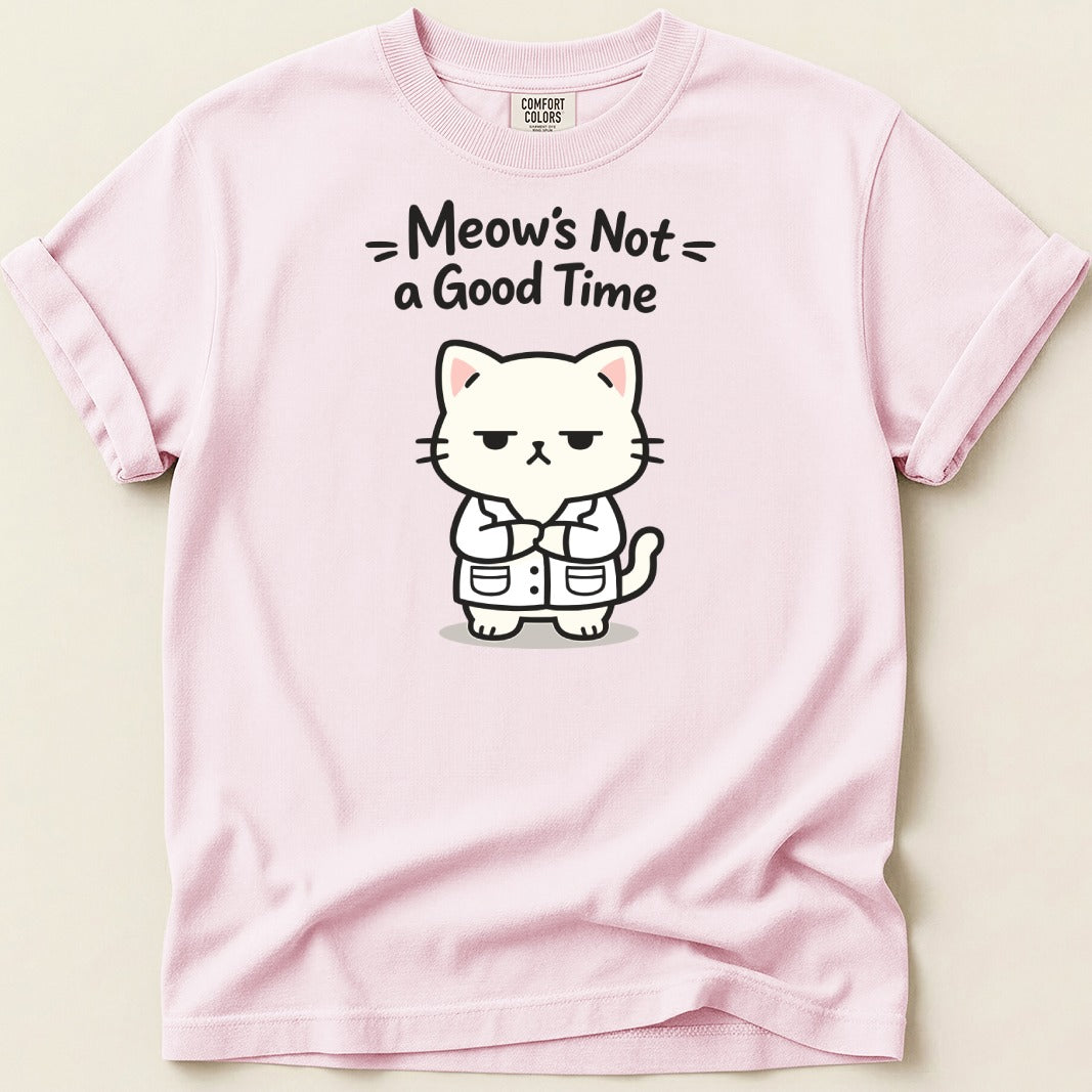 Pink t-shirt with a cartoon of a grumpy cat in a lab coat and text "Meow's Not a Good Time".