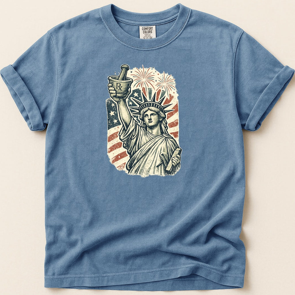 Statue of Liberty holding mortar and pestle with American flag and fireworks.