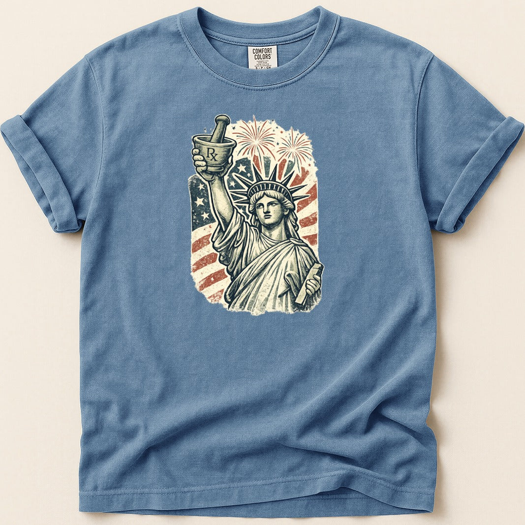 Statue of Liberty holding mortar and pestle with American flag and fireworks.