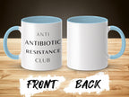 White mug with blue handle and interior,  "ANTI ANTIBIOTIC RESISTANCE CLUB" text.