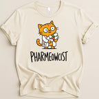 Cream t-shirt with cartoon orange cat in lab coat holding pills, text "PHARMEOWCIST".