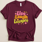Maroon t-shirt with "Live Laugh Lexapro" text in colorful retro lettering.