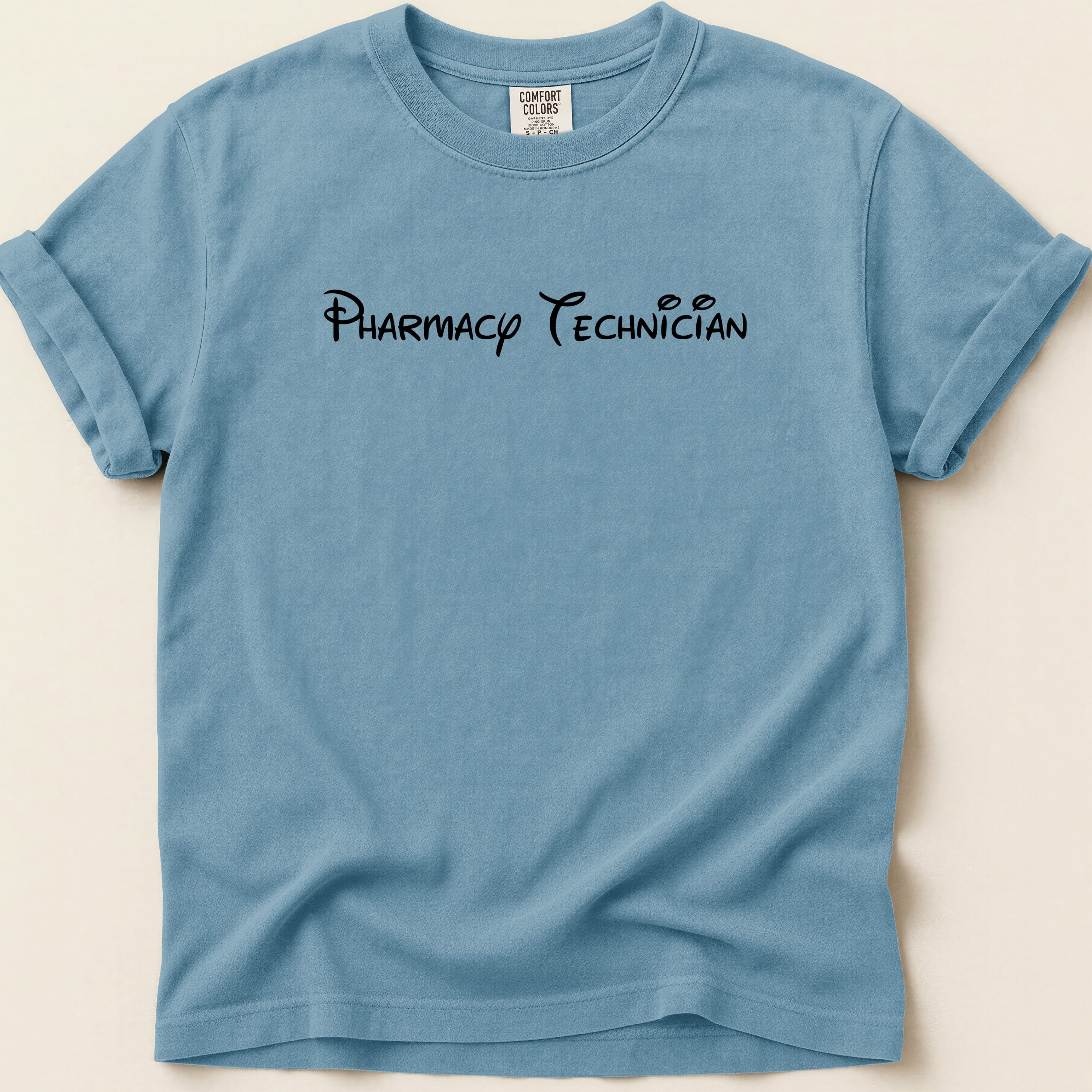 Blue t-shirt with "Pharmacy Technician" text in black cursive font.