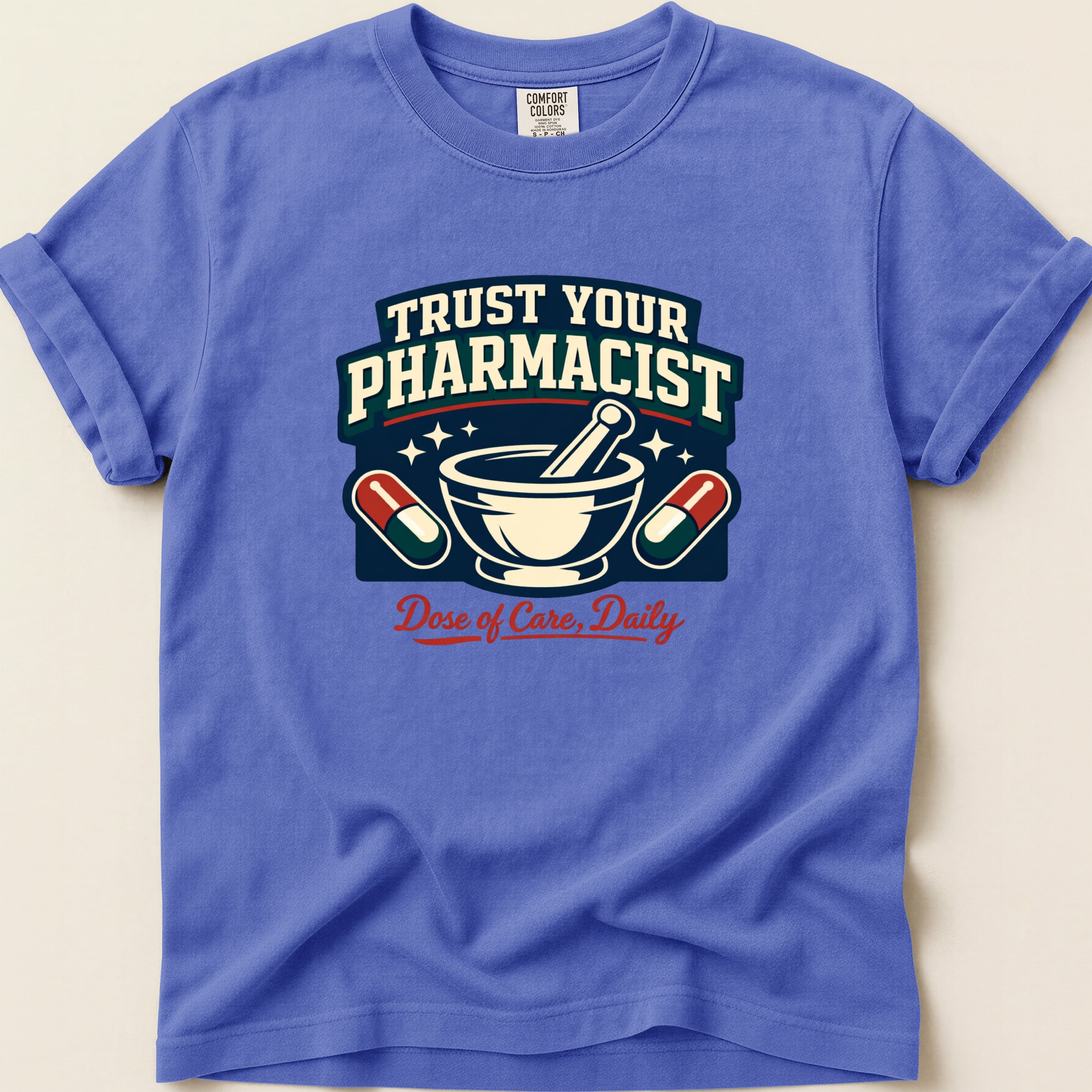 Blue t-shirt with "Trust Your Pharmacist" and mortar and pestle graphic.