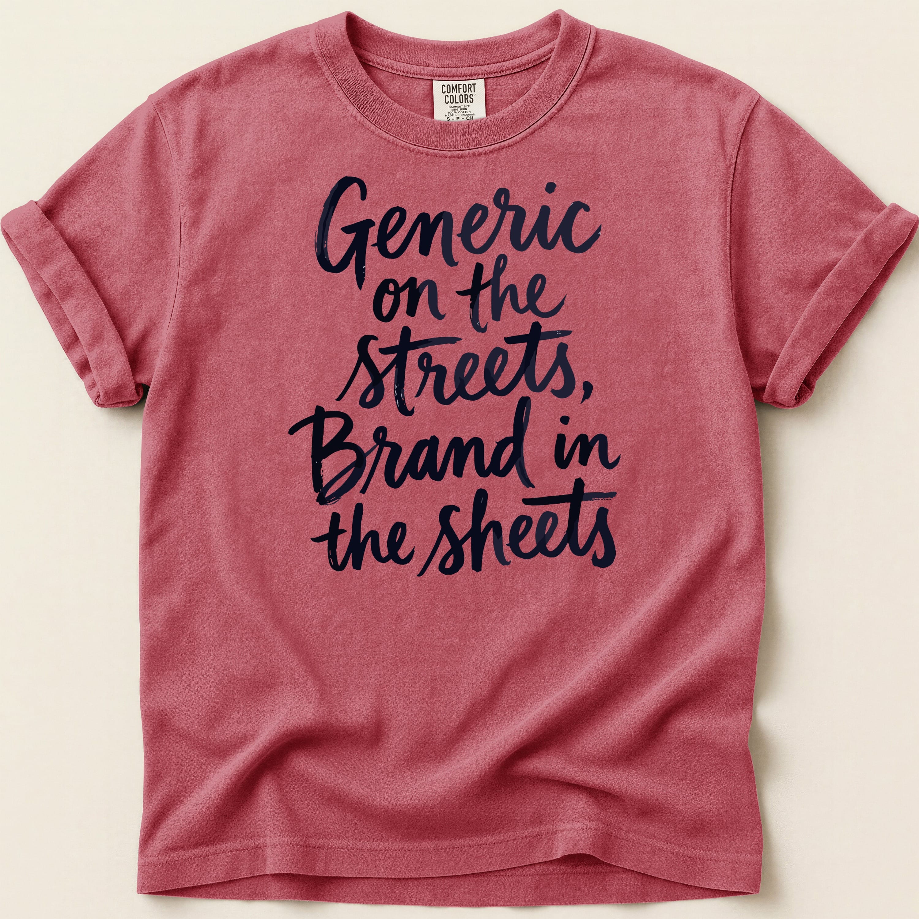 Red t-shirt with "Generic on the streets, Brand in the sheets" printed in dark blue text.
