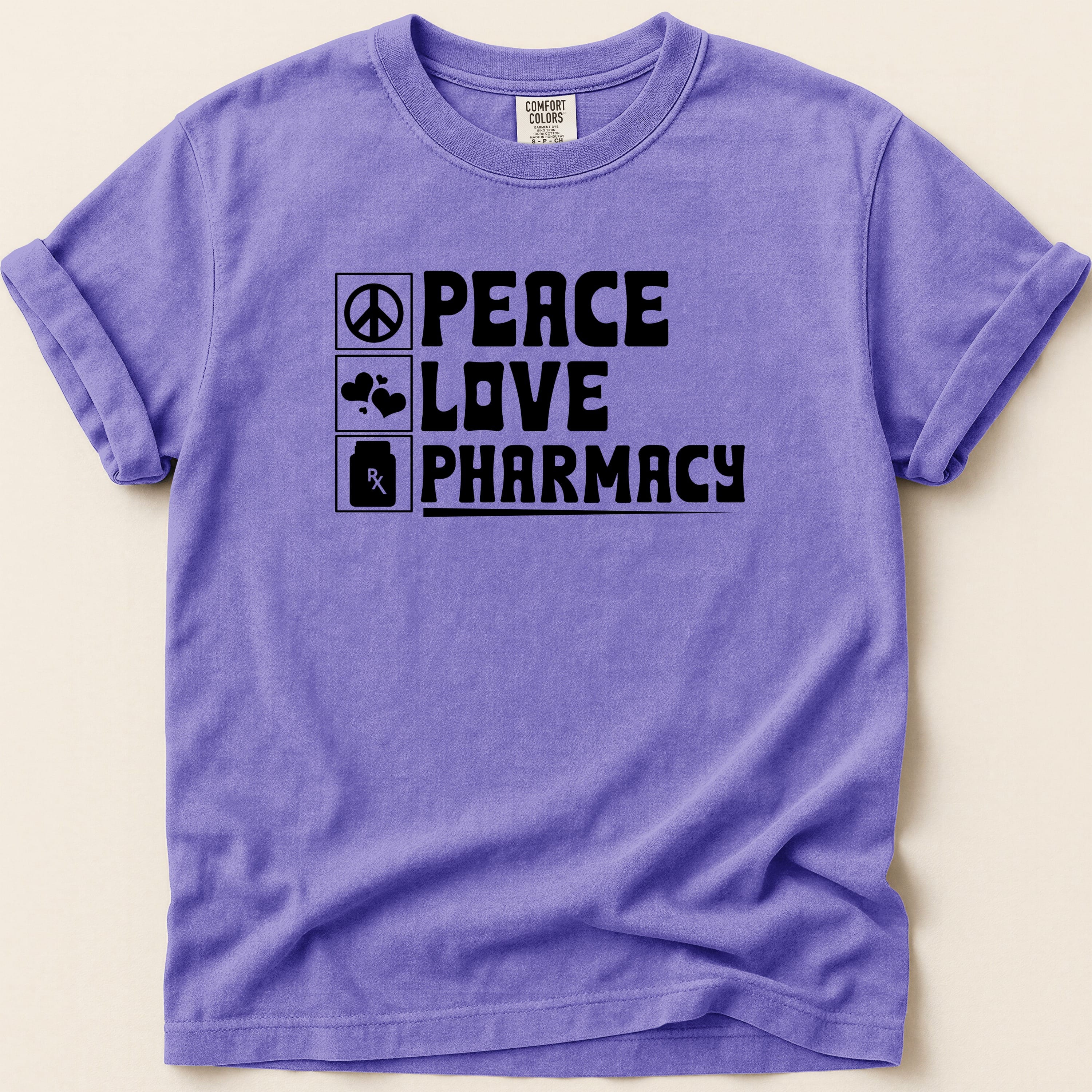 Purple t-shirt with "Peace Love Pharmacy" in black text.