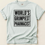 Light blue t-shirt with black text "WORLD'S GRUMPIEST PHARMACIST".