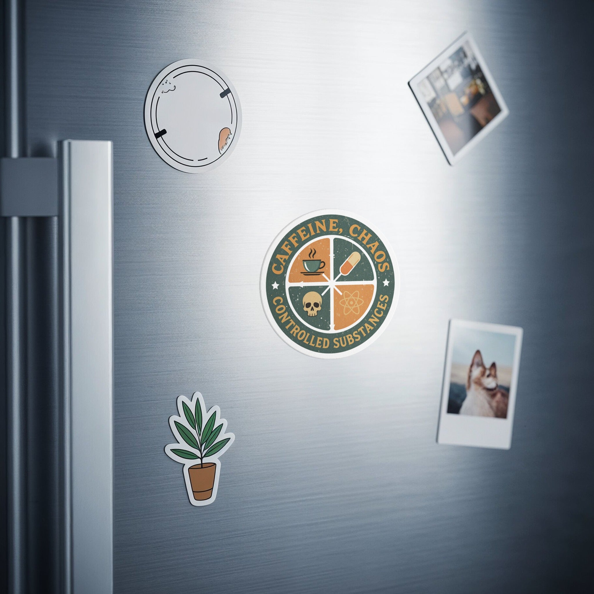 Circular magnet with "Caffeine, Chaos, Controlled Substances" text and coffee icons.