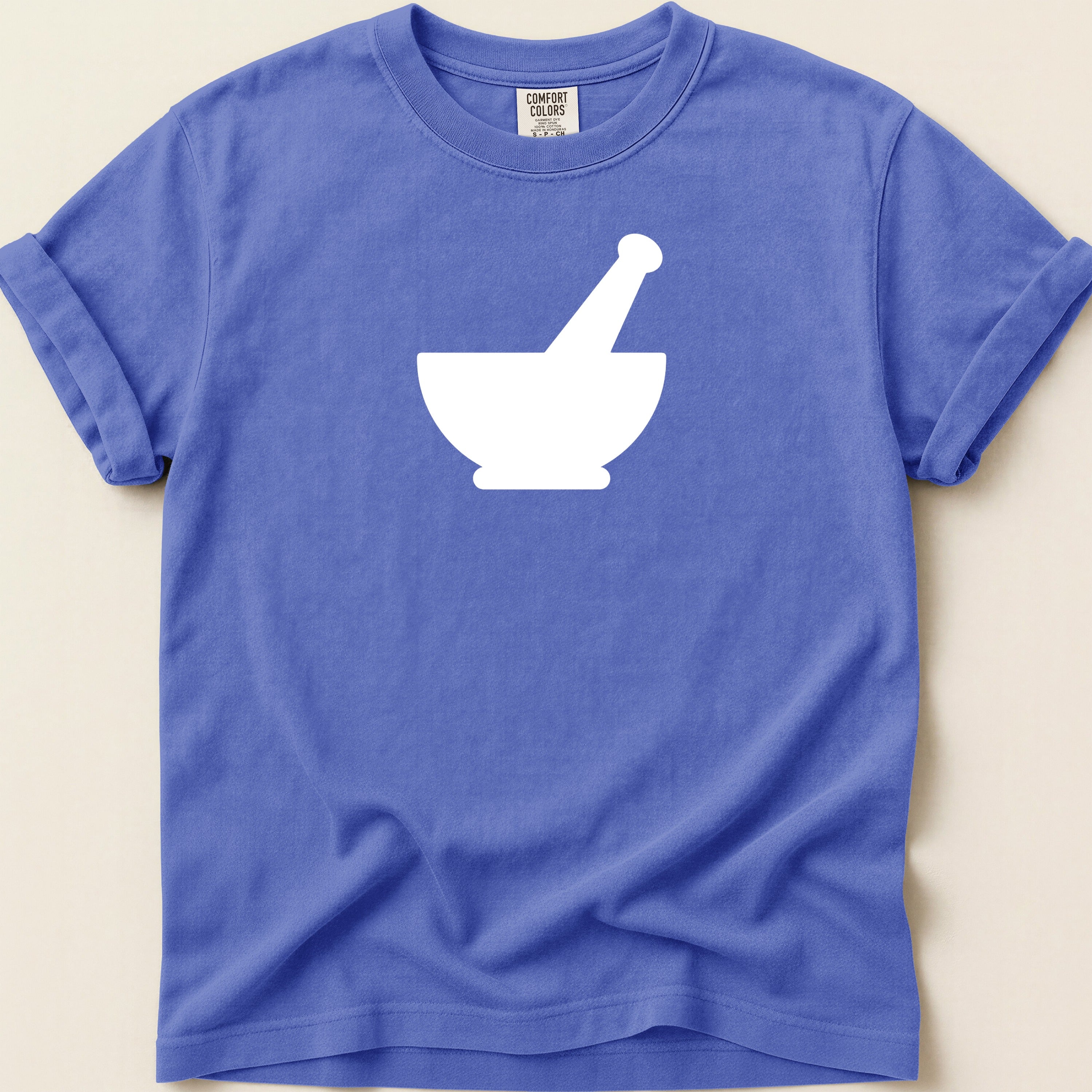 Blue t-shirt with white mortar and pestle graphic and Comfort Colors label.