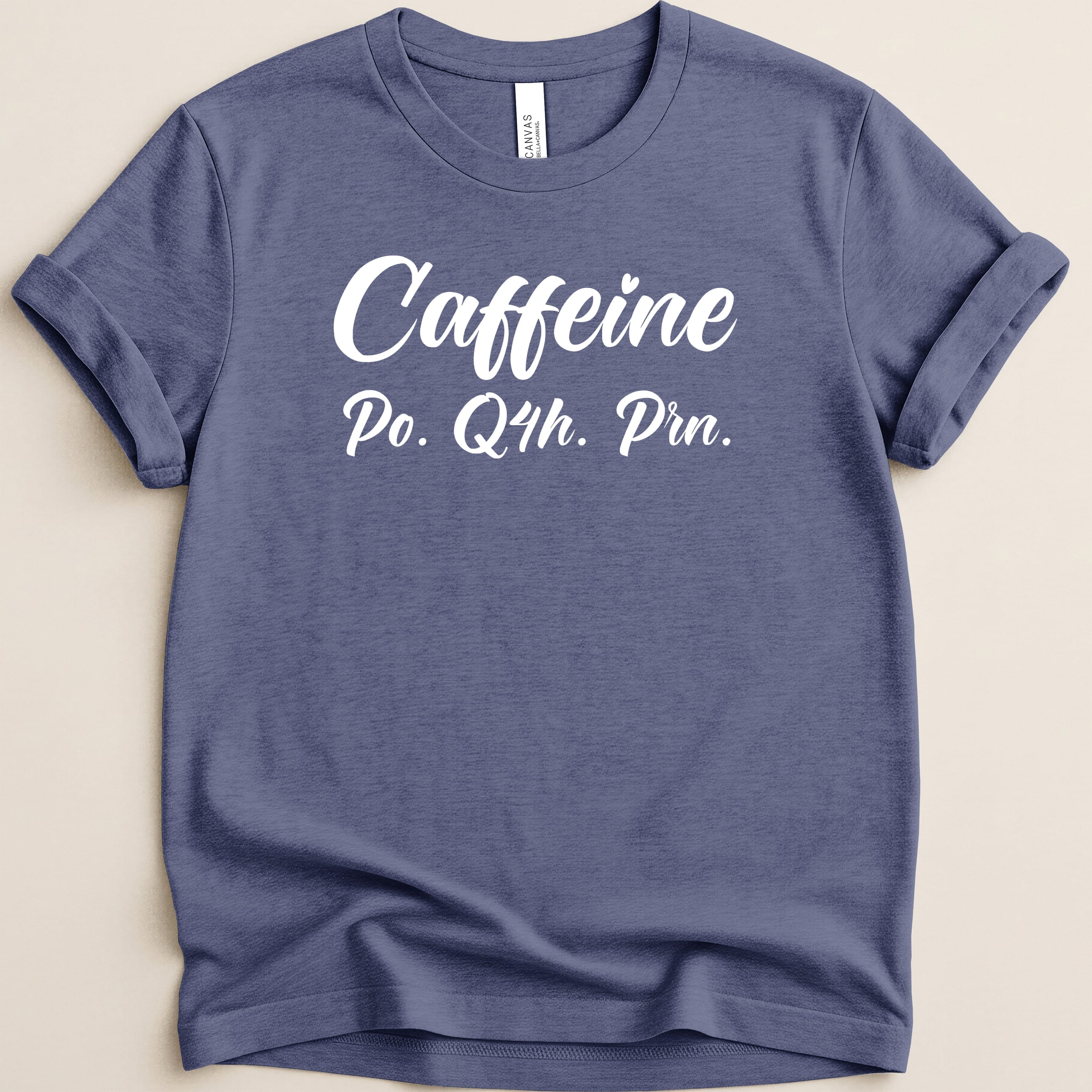 Blue t-shirt with white text "Caffeine Po. Q4h. Prn."