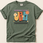 Green t-shirt with "Pharmacy is my Jam" in colorful retro lettering and floral accents.