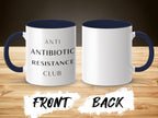 White mug with navy blue interior and handle, reads "ANTI BIOTIC RESISTANCE CLUB."