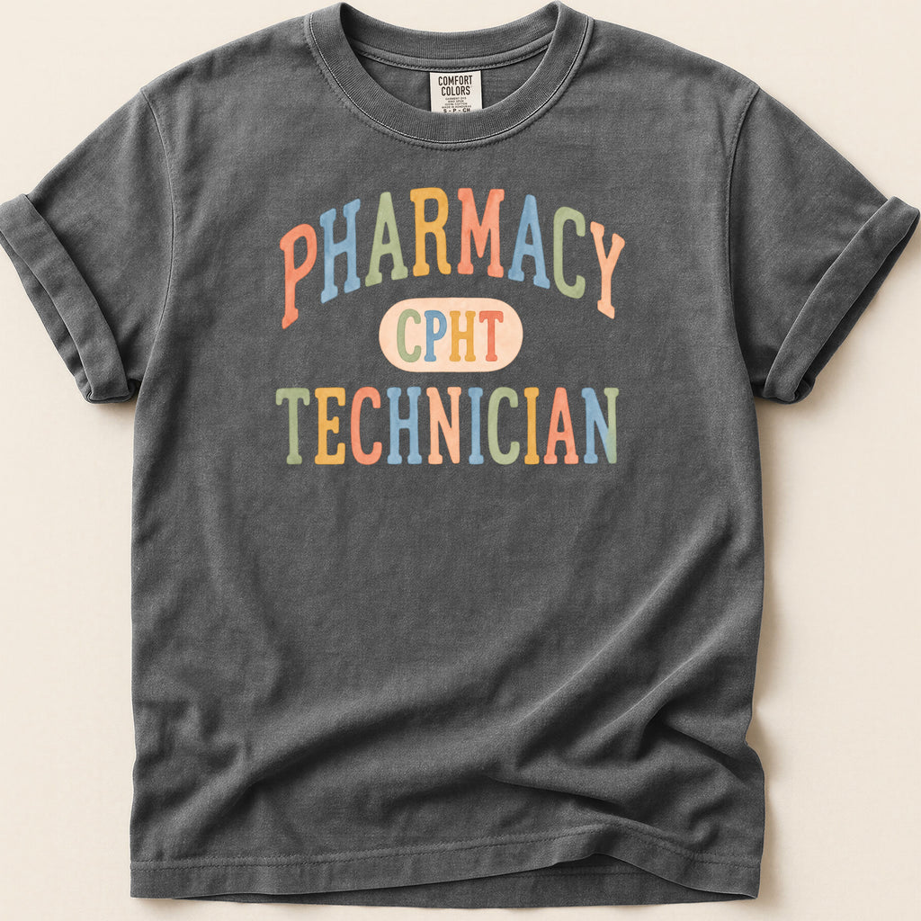 Dark gray t-shirt with "PHARMACY CPHT TECHNICIAN" text in colorful lettering.