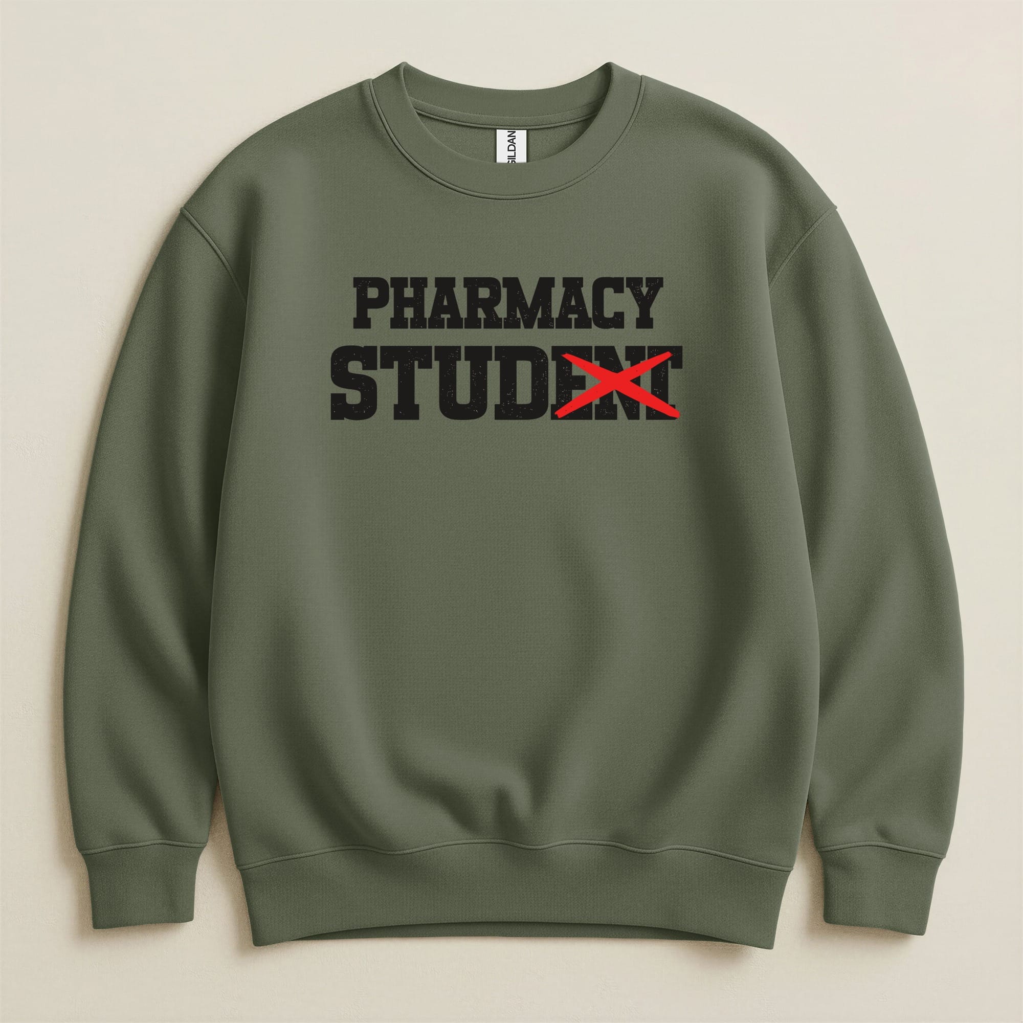 Olive green sweatshirt with "PHARMACY STUDENT" text, red X over "STU".