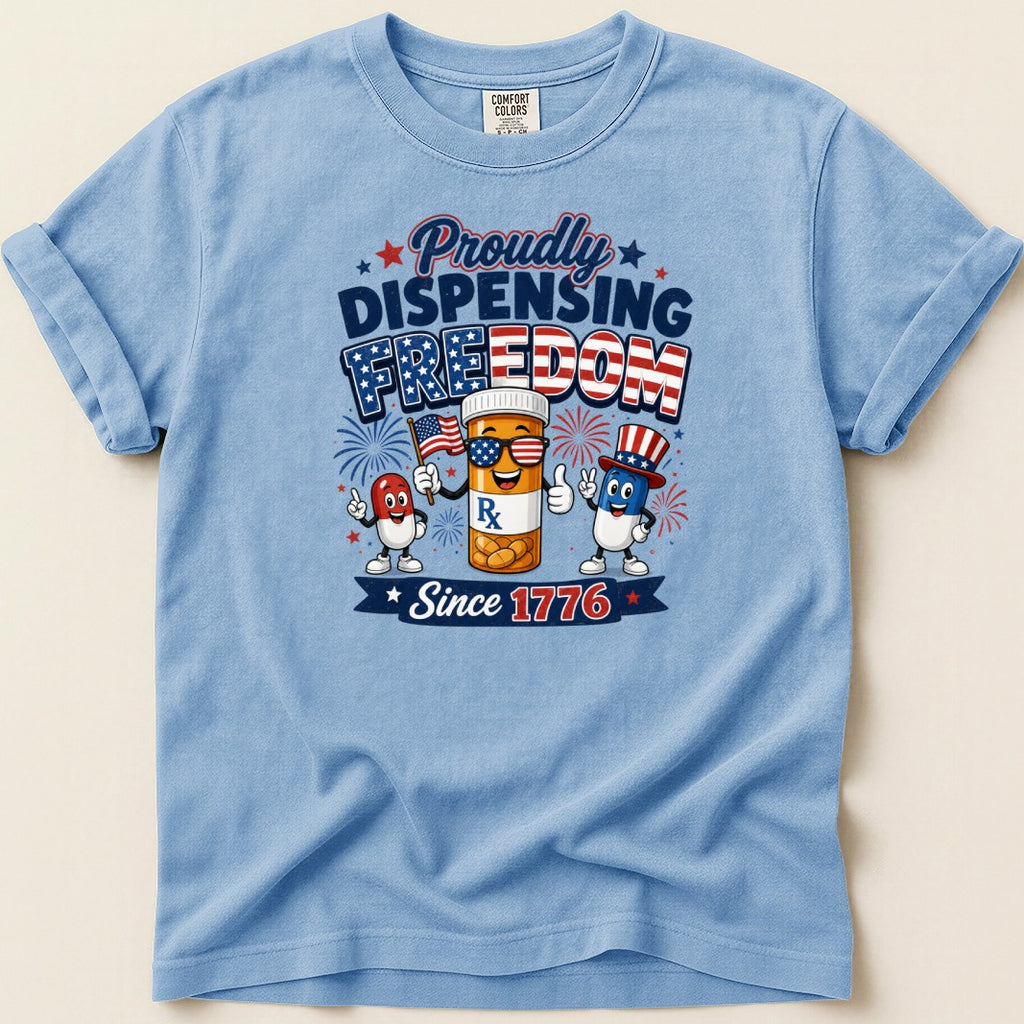 T-shirt with cartoon pills celebrating "Proudly Dispensing Freedom Since 1776".