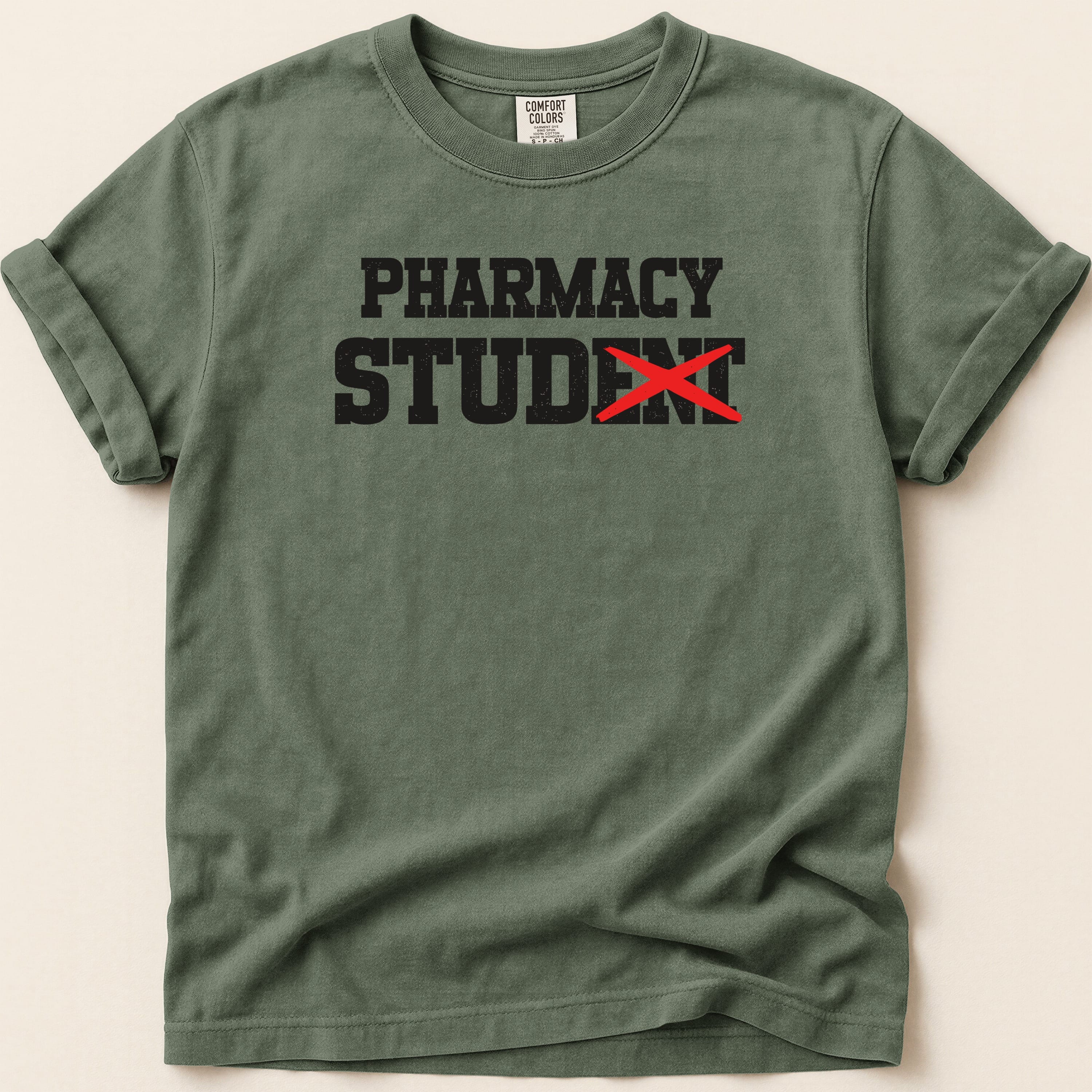 Green t-shirt with "PHARMACY STUDENT" and a red X over "STUDENT".