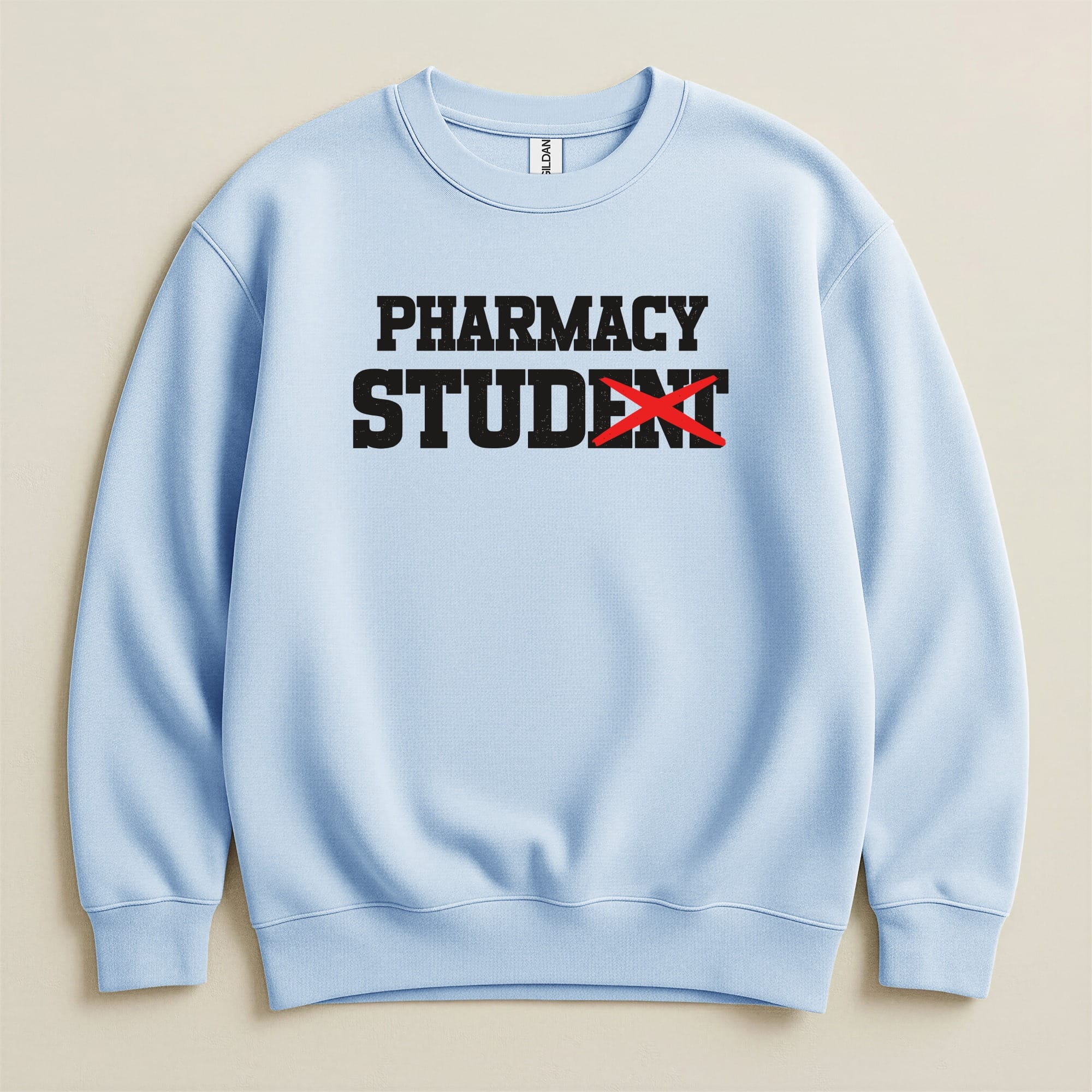 Light blue sweatshirt with "PHARMACY STUDENT" text, the "ENT" is crossed out with red.