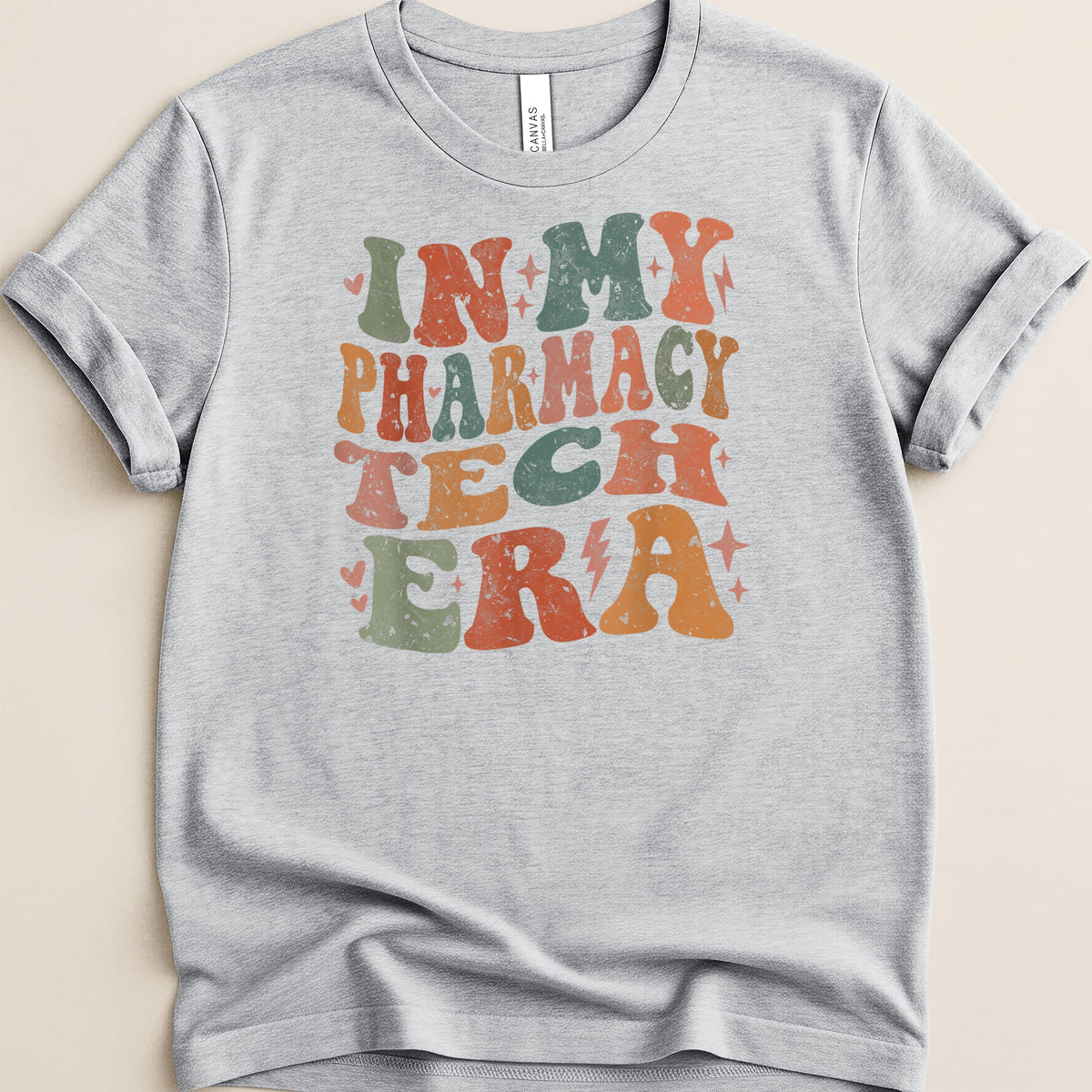 Light gray t-shirt with distressed text "IN MY PHARMACY TECH ERA".