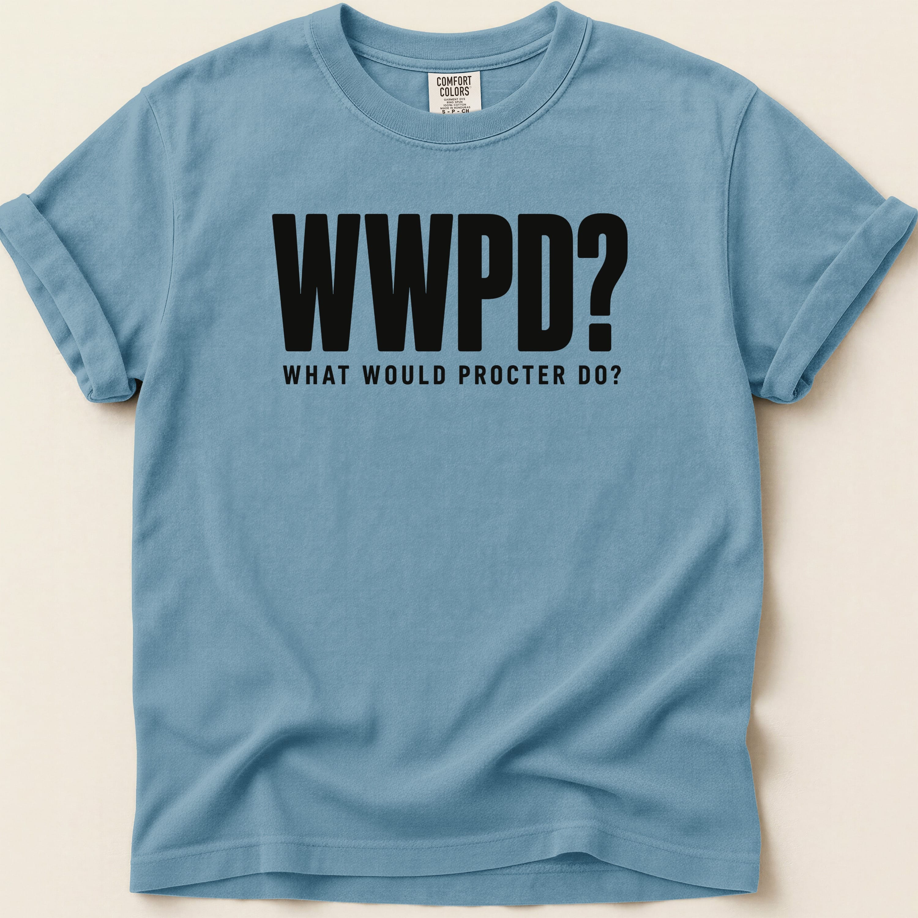 Blue t-shirt with "WWPD? WHAT WOULD PROCTER DO?" text.