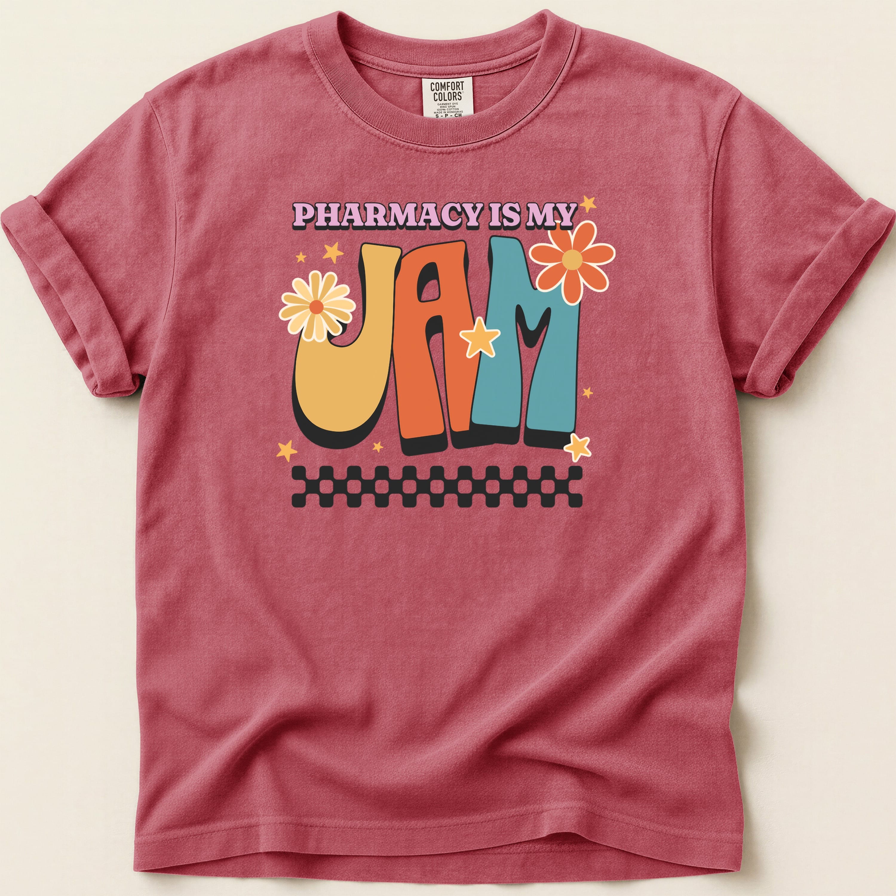T-shirt with "Pharmacy is My Jam" text and retro floral graphics.