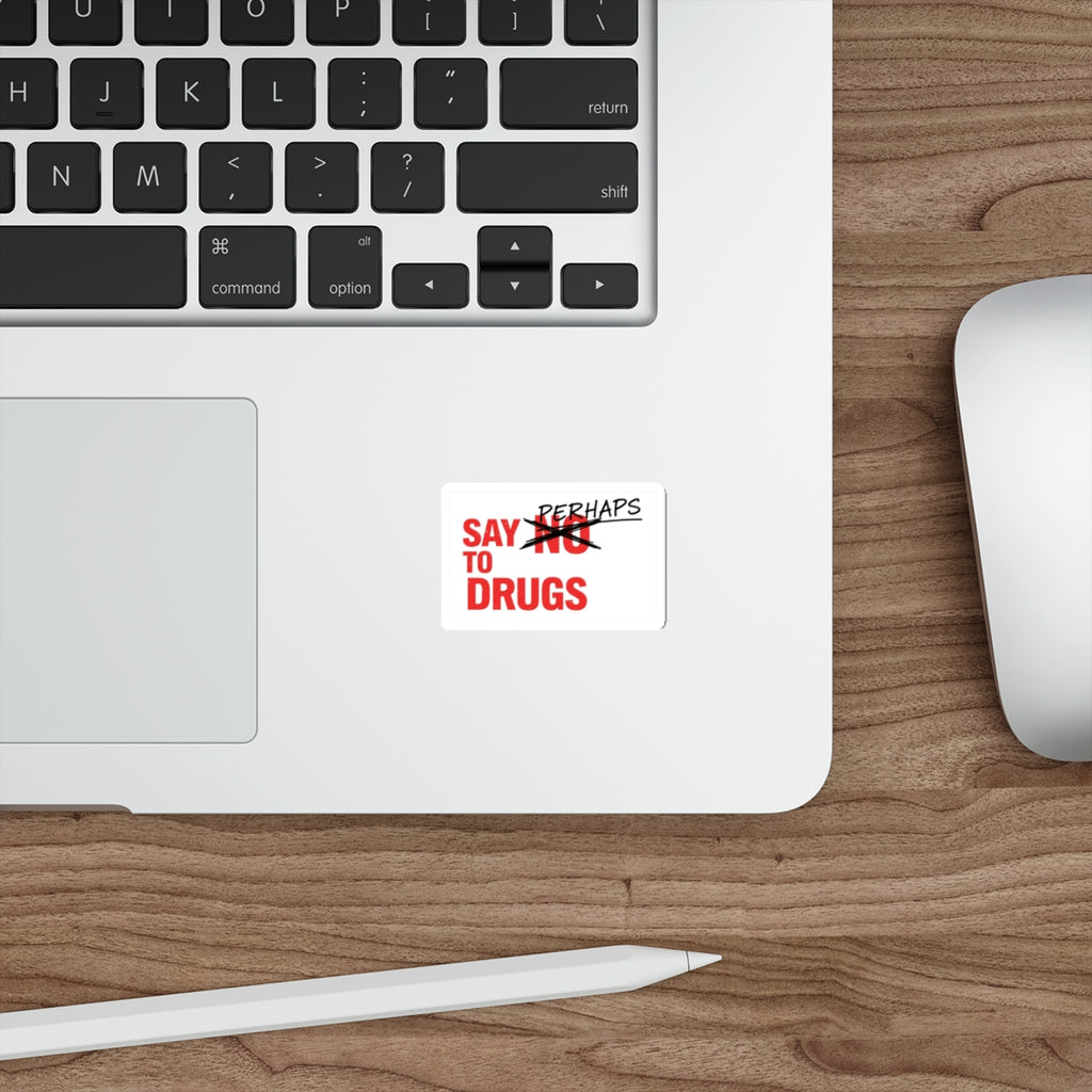 Sticker on laptop keyboard saying "SAY NO TO DRUGS" with "PERHAPS" above it.
