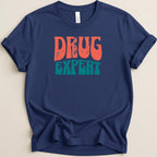 Navy t-shirt with "DRUG EXPERT" in retro orange and teal lettering.